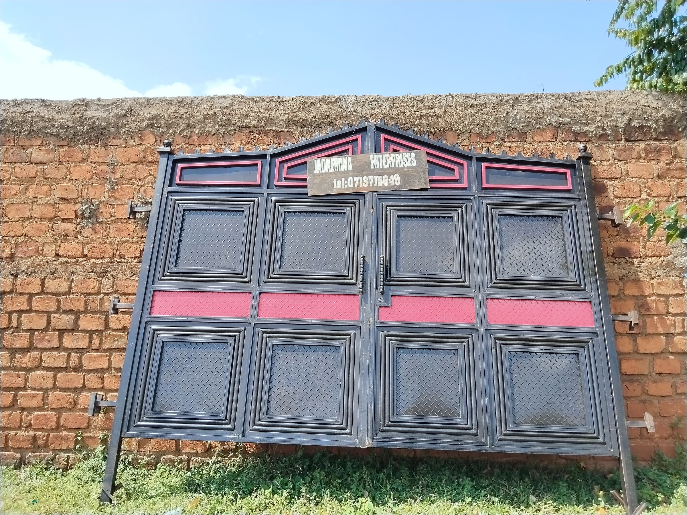 Black & Rose Panel Gate on Brick Wall
