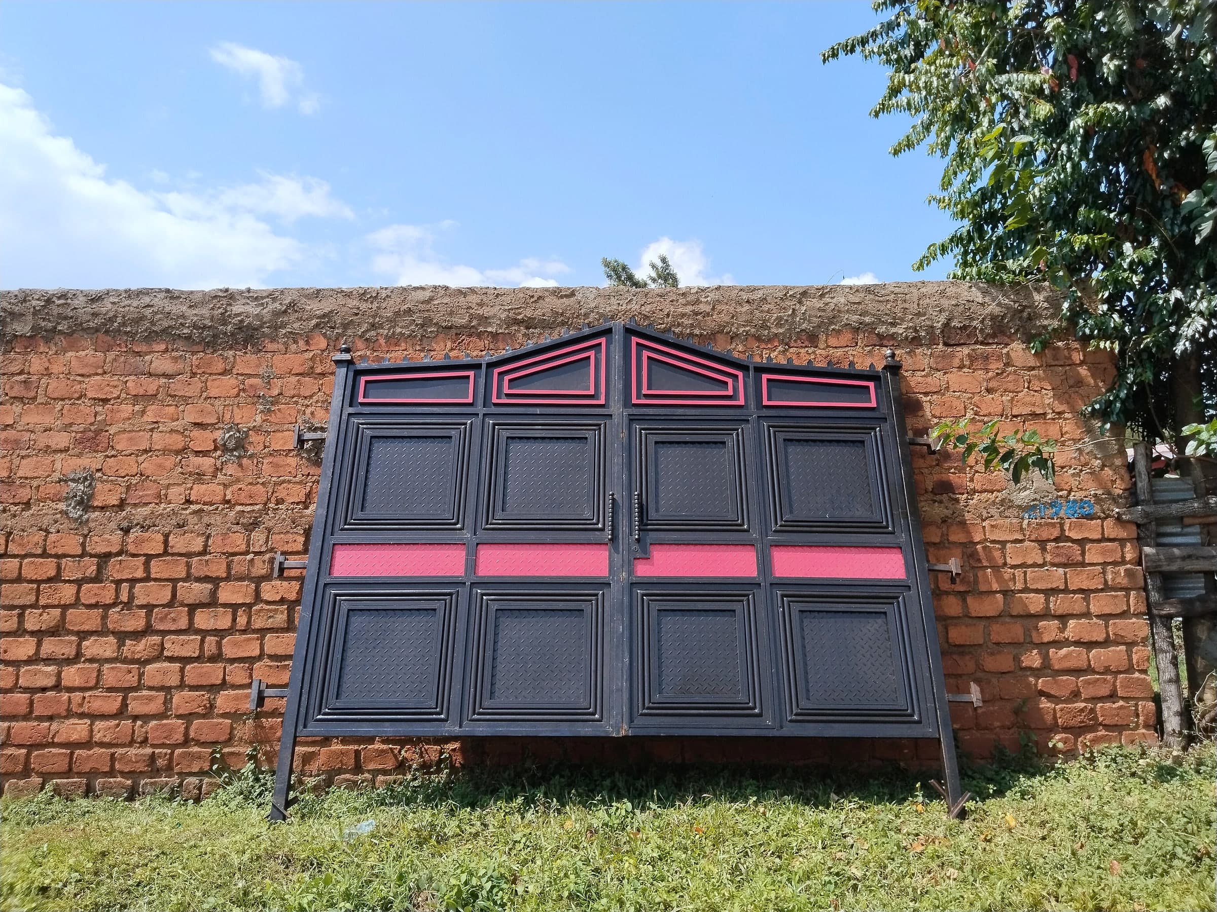 Black & Rose Panel Gate on Brick Wall