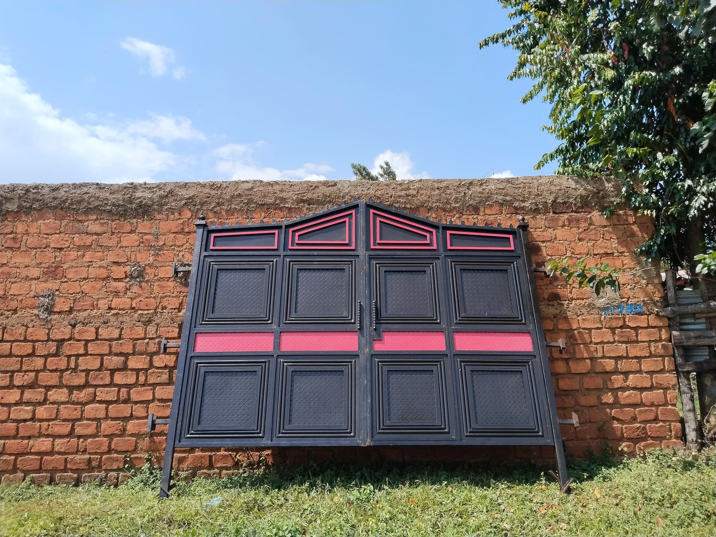 Black & Rose Panel Gate on Brick Wall
