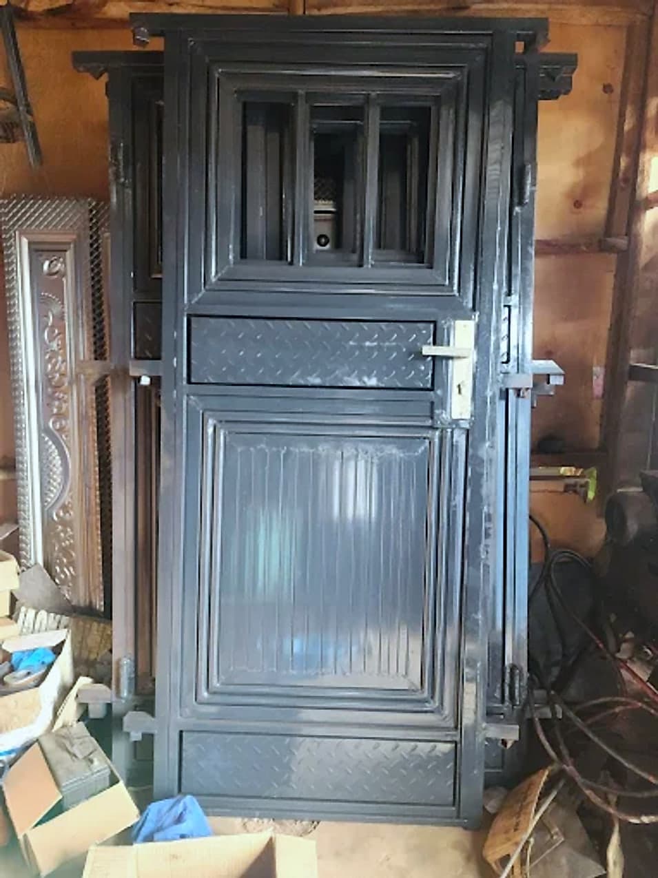 Grey Steel Door Hung in the Workshop