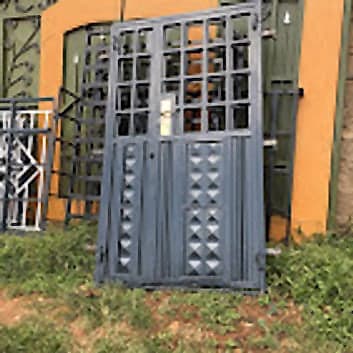 Studded Security Door with Grill Fanlight